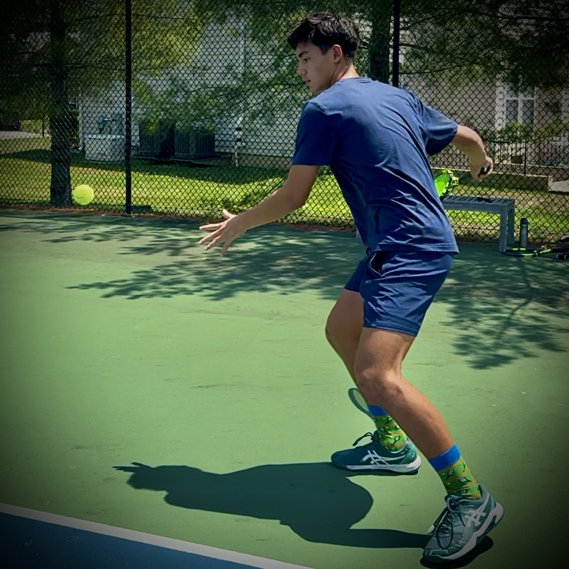 Judah preparing to strike a forehand